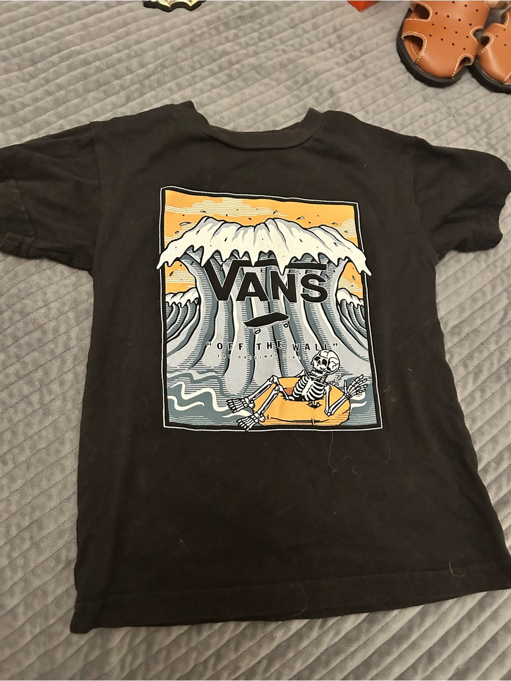 Vans Black Kids Tee with Yellow & Blue Surf Skeleton Graphic